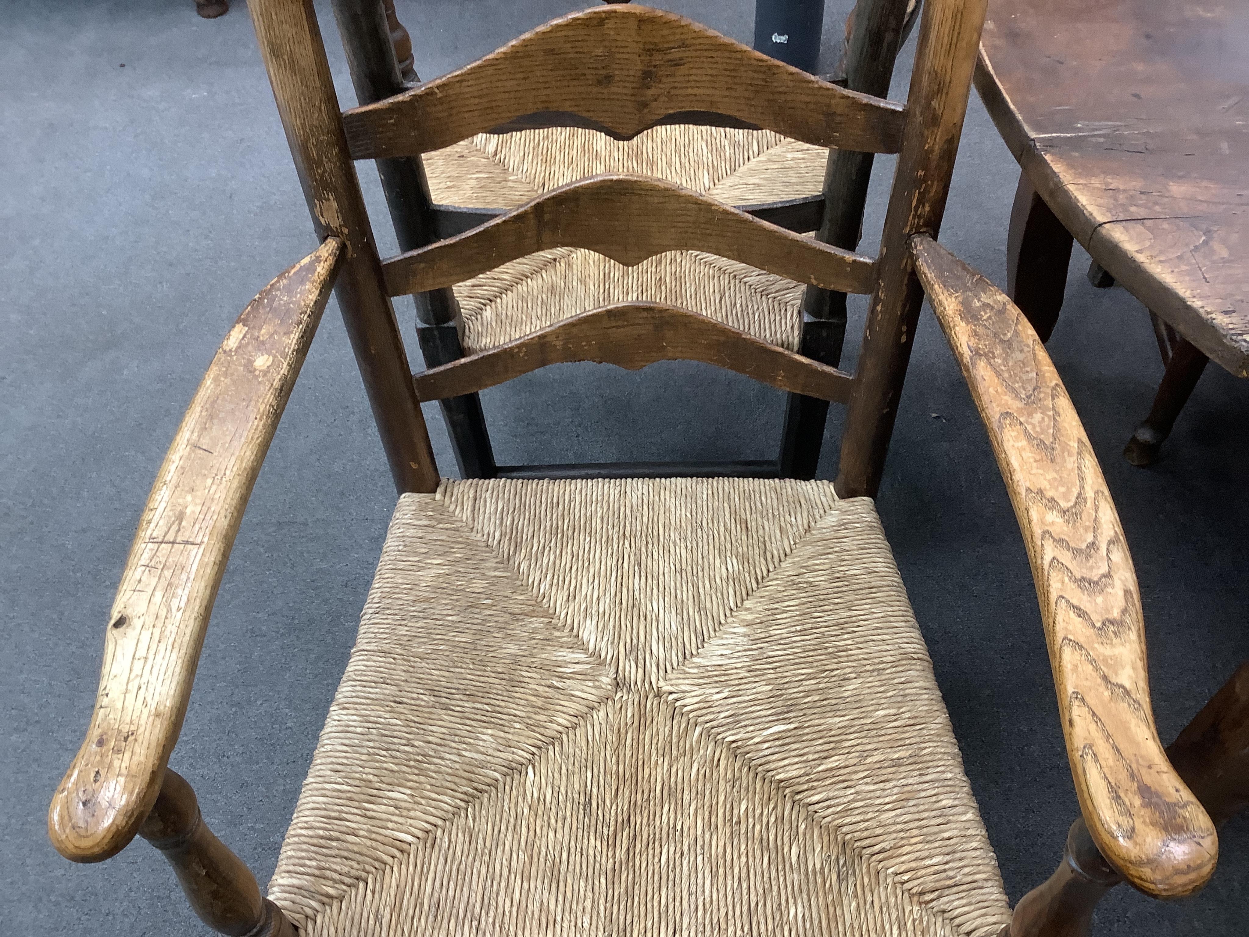 A harlequin set of eight 18th century ash ladderback rush seat dining chairs, two with arms